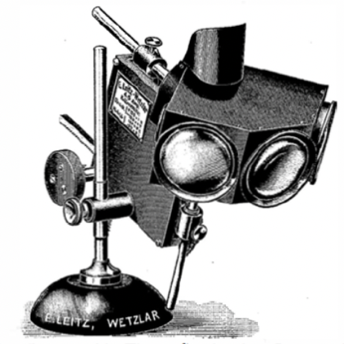 A black and white photo of a camera
Description automatically generated with low confidence