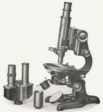 A picture containing indoor, microscope, black, set
Description automatically generated