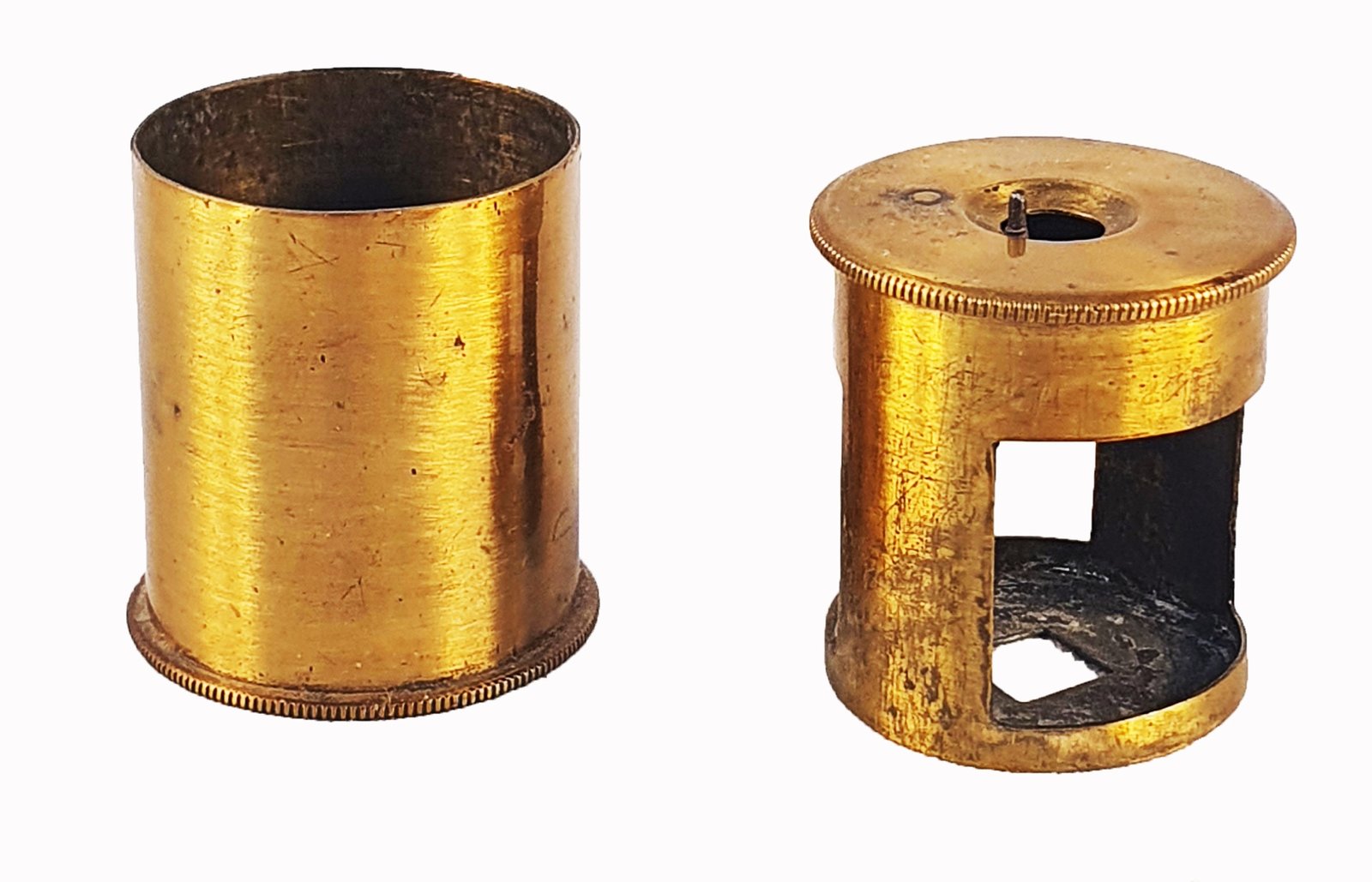 A gold cylinder with holesDescription automatically generated