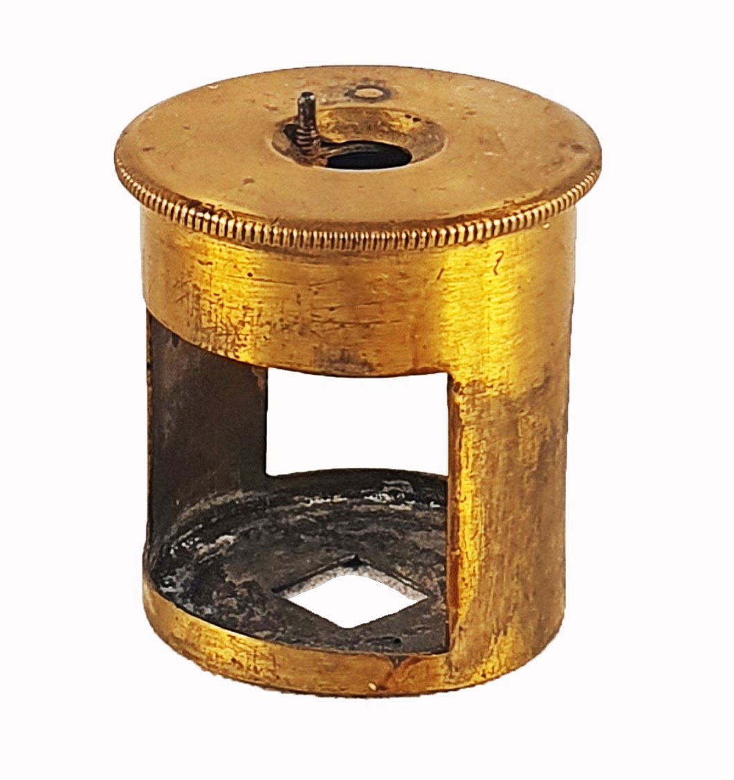 A gold object with a holeDescription automatically generated