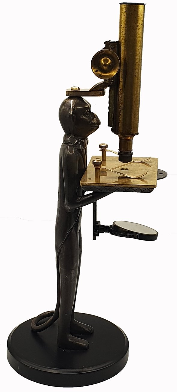Microscope Statue A statue of a person holding a microscopeDescription automatically ...