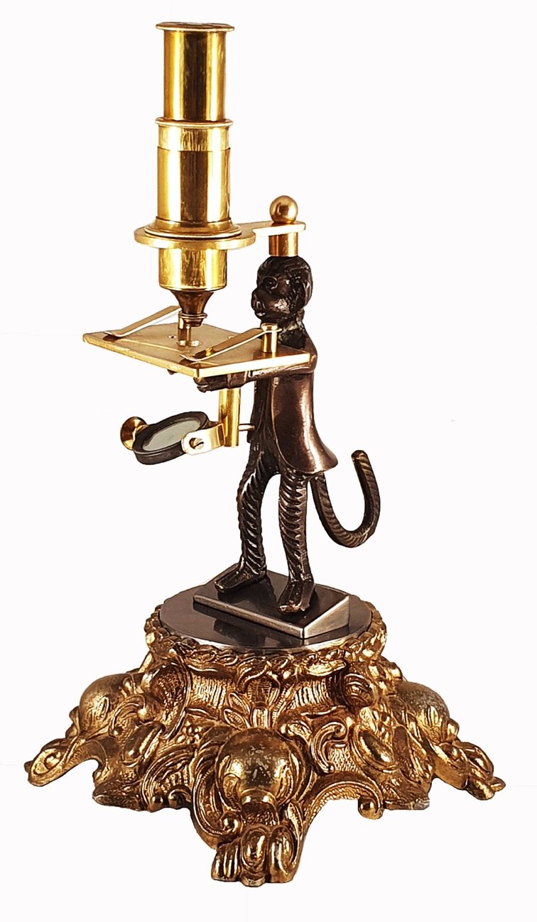 A statue of a monkey holding a candleDescription automatically generated