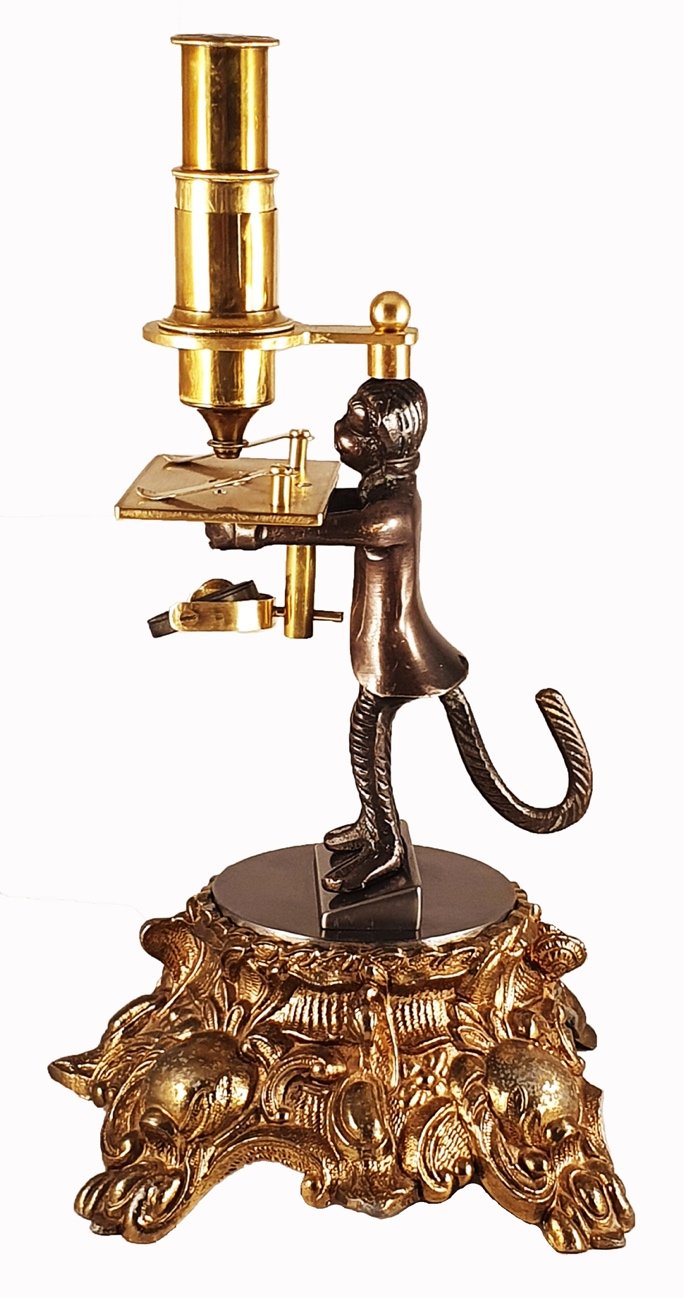 A statue of a monkey holding a trayDescription automatically generated