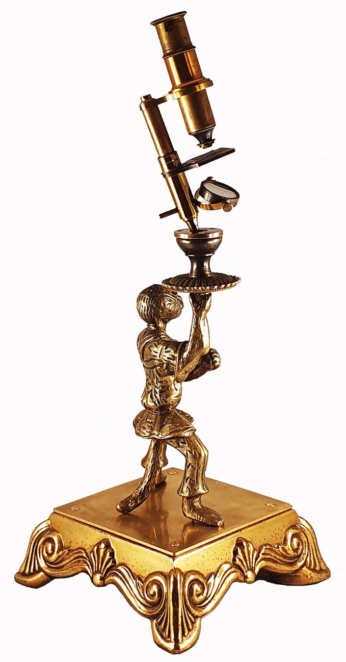 Microscope Statue A gold statue of a person holding a microscopeDescription automatically ...