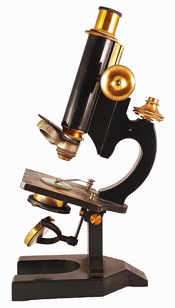 Microscope Statue A picture containing table, sitting, person, statueDescription ...