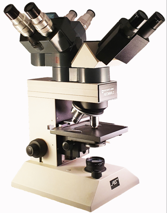 A picture containing microscope, indoor
Description automatically generated