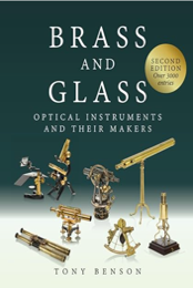 A book cover of brass and glass
Description automatically generated